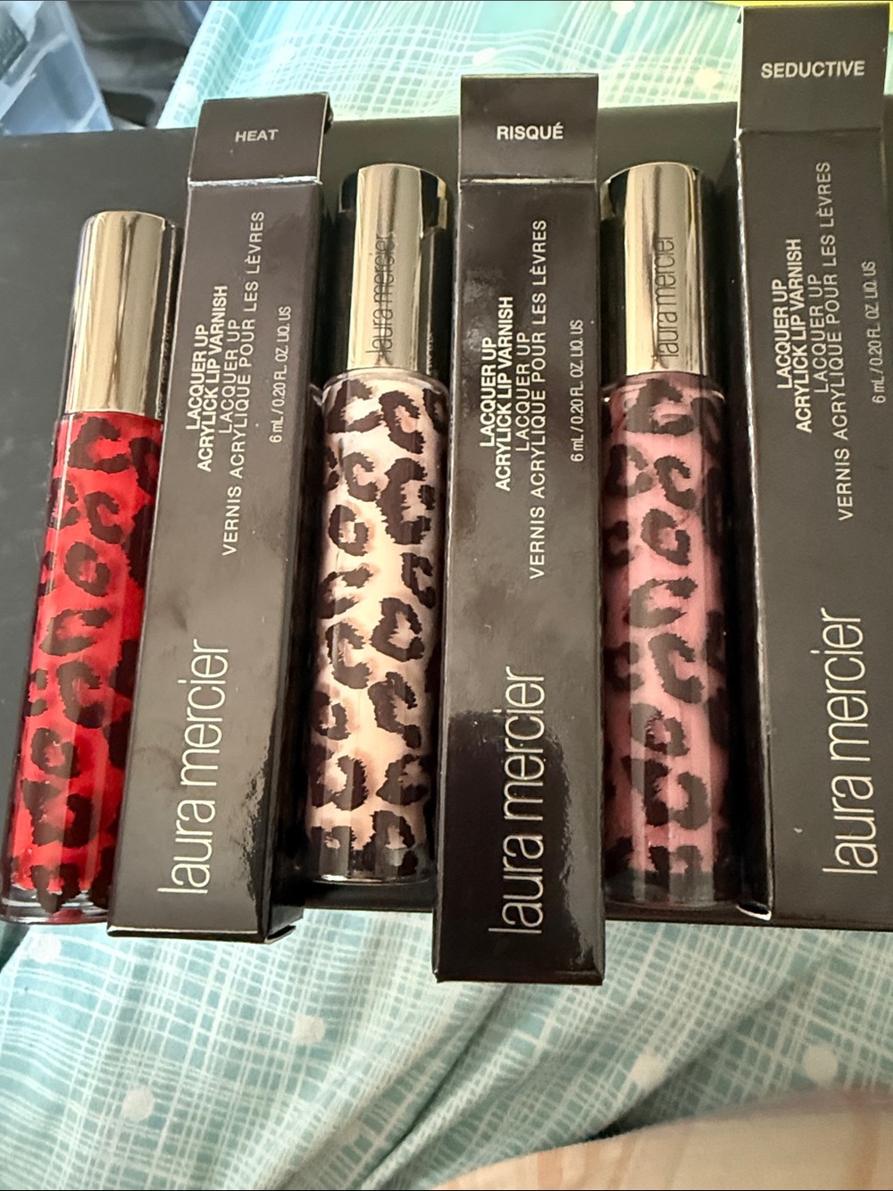 laura mercier Leopard-Pattern Lacquer Lip Colors in Red, Pink, and Nude